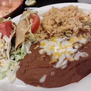 2 shredded taco, rice/beans