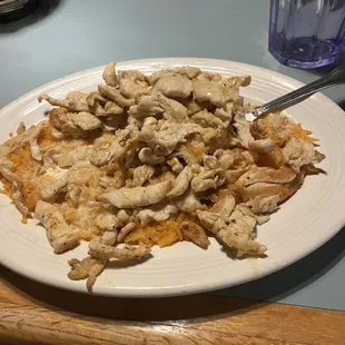 a plate of chicken and cheese casserole