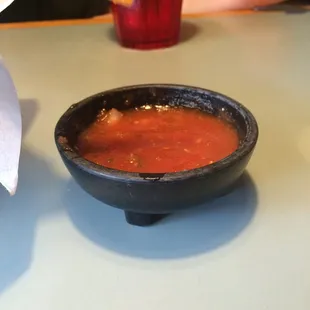 Salsa in a cute little dish.