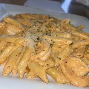 a plate of pasta with shrimp