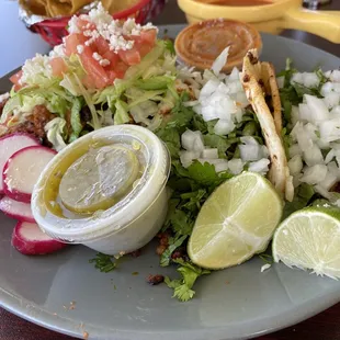 Two tacos chorizo and an al pastor sope. $10.