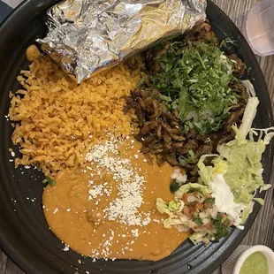 Al pastor with corn tortillas rice and beans