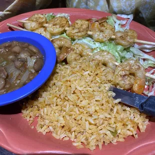 Shrimp, beans, and rice served fresh and on a very hot plate. Love it when it comes in fresh and hot!