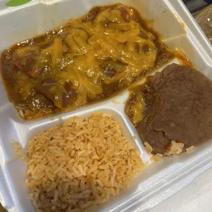 Cheese enchilada plate delivered by Door Dash. Rice is light and airy, gently spiced.