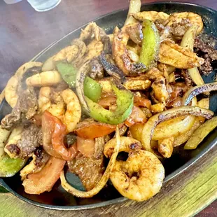 Fajitas trio. Comes with rice, beans, and choice of tortillas.