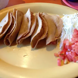 Tacos de Papa Dorados - Five crispy corn potato tacos with cabbage, tomato.