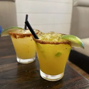 Two house margaritas, one with passion fruit, the other with spicy mango. 5 stars!!!