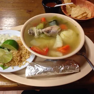 Hot Chicken soup with rice and tortilla