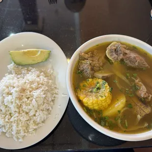 Beef soup with white rice and avocado
