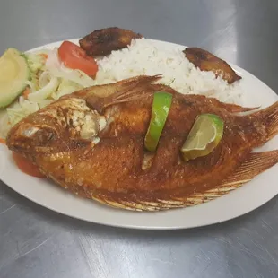 a plate of fish and rice