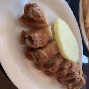 Chicharrones con Arepa (pork with corn cake)