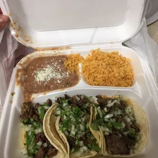 Carne Asada tacos with beans and rice