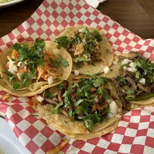 Four different tacos The carnitas was a bit bland but I could have eaten five of each of the other.  Meat was tasty and not at all dry.