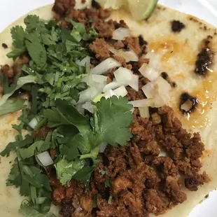 Chorizo taco with onion and cilantro