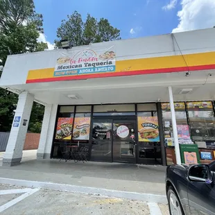 Store front - next to a Shell gas station