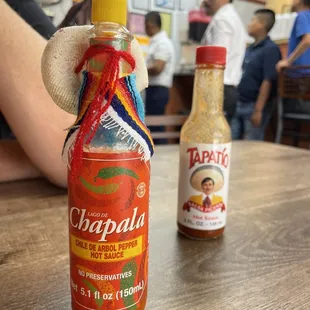 two bottles of hot sauce