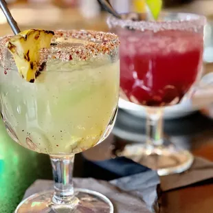 two margaritas with pineapple garnish