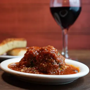 Housemade Meatballs simmered in our Sugo sauce.