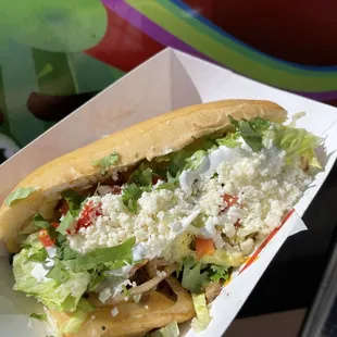 Torta - Mexican sub. Served on a hoagie roll and topped with OMG toppings + jalapeños. 

We&apos;re not just tacos!!