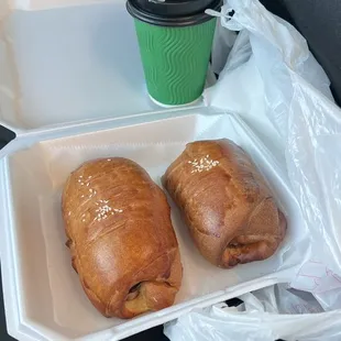 two croissants and a cup of coffee