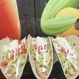 Chicken OMG Tacos - custom made to order, the set of 3 tacos comes with diced chicken, lettuce, tomatoes, fresco cheese, and sour cream.