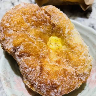 a doughnut on a plate on a table