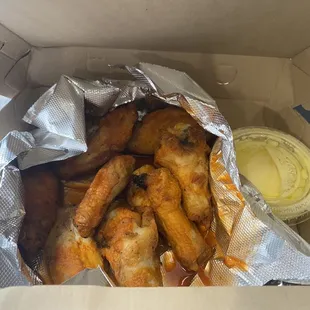 Hot sauce wings with side of garlic butter