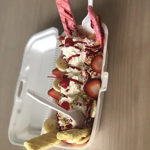 an ice cream sundae with strawberries and bananas