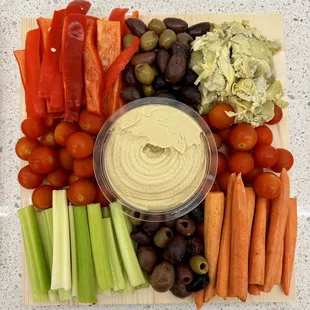 a platter of vegetables and dip