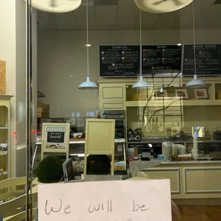 a sign in the window of a restaurant