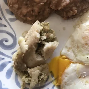 A freshly unwrapped tamale (without being cut) that was tiny and definitely NOT worth the $20/dozen for Xmas morning. Last time ordering.