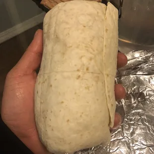 I have a large hand, this shows how big the burrito is.