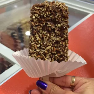 We ordered a pistachio ice cream Popsicle. We asked to get it dipped in chocolate and pecans.