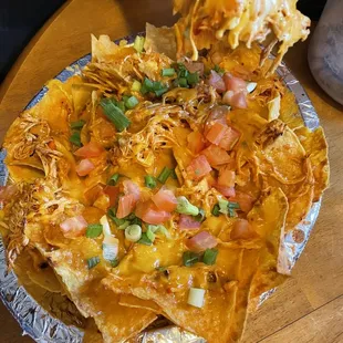 a plate of nachos on a table