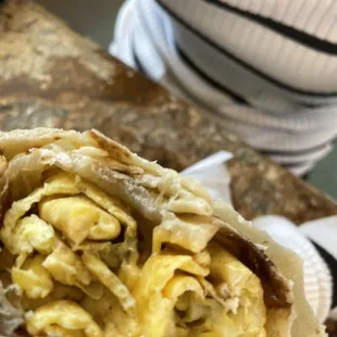 Breakfast burrito with eggs, and cheese