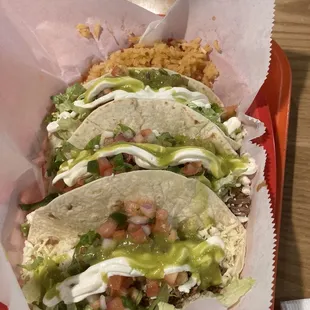 Gringo (flour tortillas) pulled pork taco meal with Mexican rice