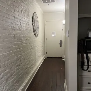 Hallway looking at the door. The walls were an actual brick.