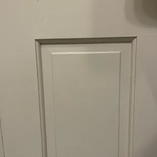 Back of bathroom door - dust, dirt and grime not cleaned off, someone else&apos;s hair stuck to the door