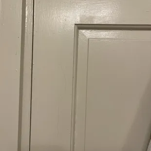 Back of bathroom door - dust, dirt and grime not cleaned off, someone else&apos;s hair stuck to the door