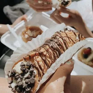 a person holding a pastry