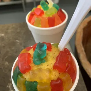 Double scoops in a cup topped with artfully arranged gummy bears