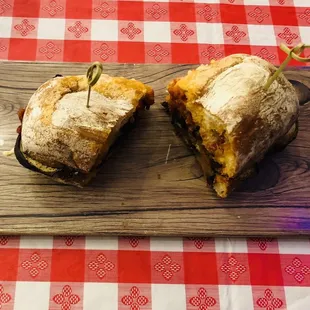 a cut in half sandwich on a cutting board