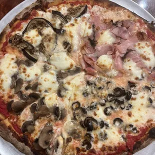 This is a four seasons pizza from La Gastronómica!