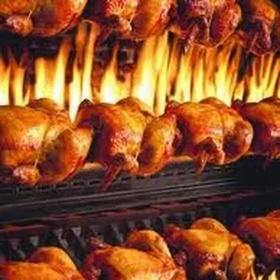 roasting chickens on a grill