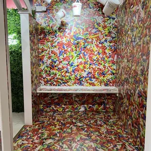 a candy machine with a lot of sprinkles