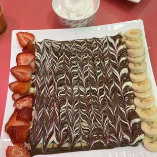 Flat Crepe with Nutella, white chocolate, strawberries and banana....  Crepe was delicious and tender. It was delicious but very heavy....