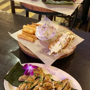 Bottom - side of chicken Mid - fried Yuca and Arepita Top - Carne (steak) and Costillas (ribs!)