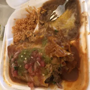 Carnitas wet burrito with rice and beans