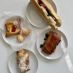 Clockwise from top: Caprese Sandwich ($6.85) Gourmandise ($3.45) Croissant aux amandes ($3.90) Panier framboise ($3.50)