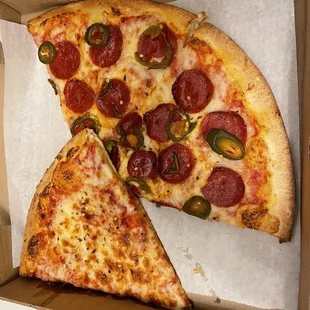 two slices of pizza in a box